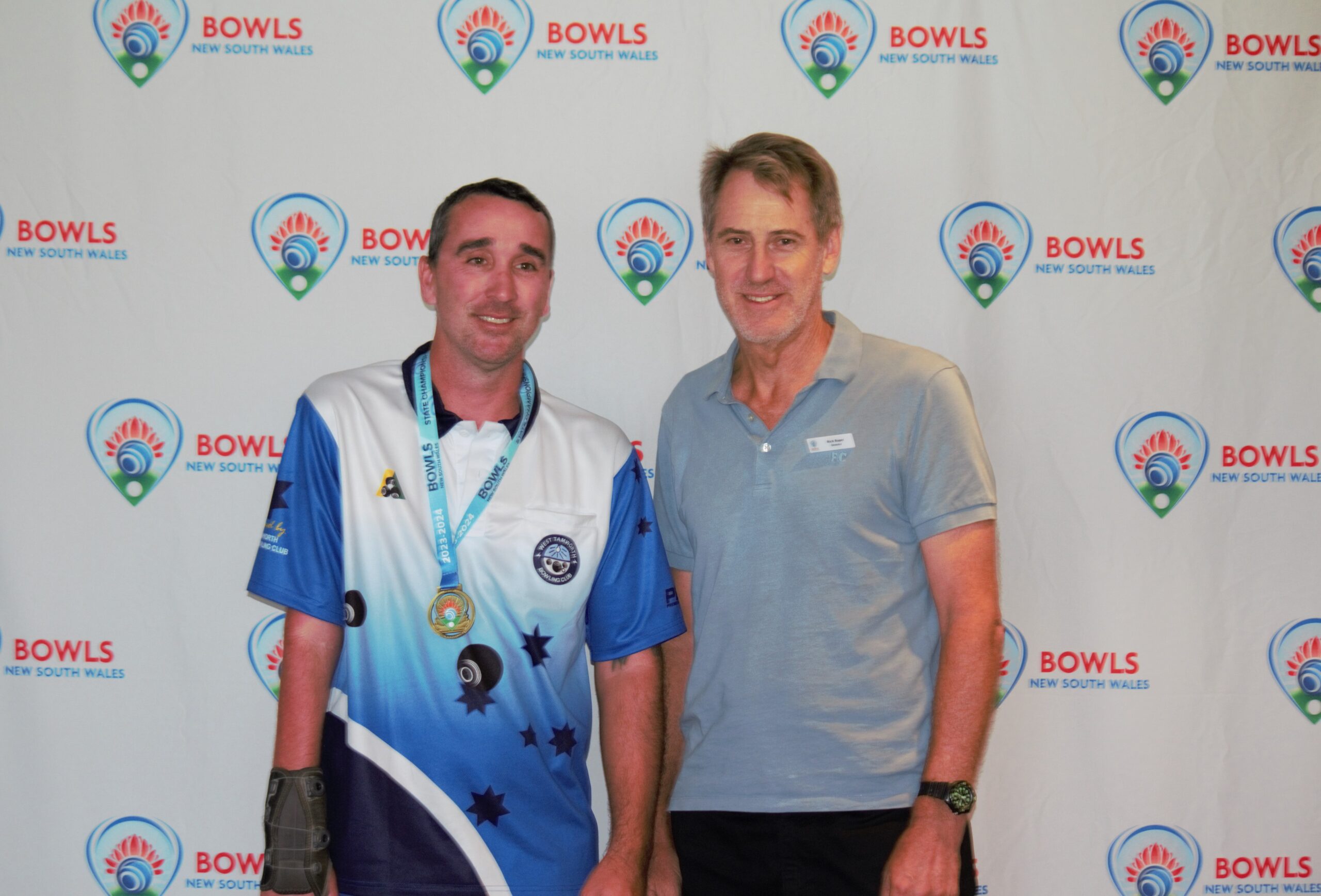 Aaron Kelly - Multi-Disability Open Singles Champion pictured with Bowls NSW Board member Rick Roper